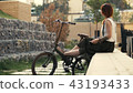 Redhaired woman cyclist making selfie on mobile phone with bike. Woman bicycling 43193433