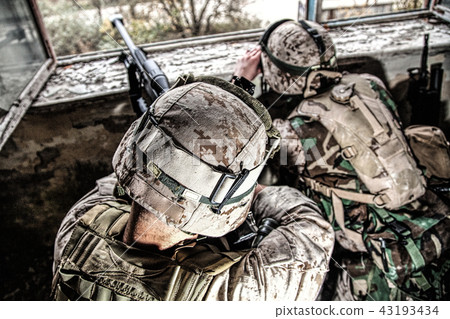Army sniper team shooting with large caliber rifle Army sniper team shooting with large caliber rifle 43193434