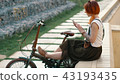 Redhaired woman cyclist making selfie on mobile phone with bike. Woman bicycling 43193435