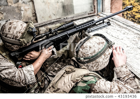 Army sniper team shooting with large caliber rifle 43193436
