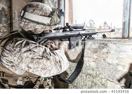 Army sniper shooting with large caliber rifle Army sniper shooting with large caliber rifle 43193438