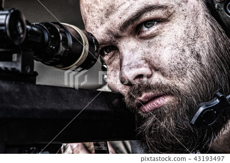 Skilled army sniper aiming with optical sight 43193497