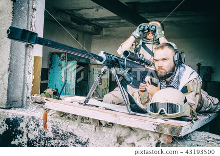 Sniper team with large caliber rifle in ambush 43193500