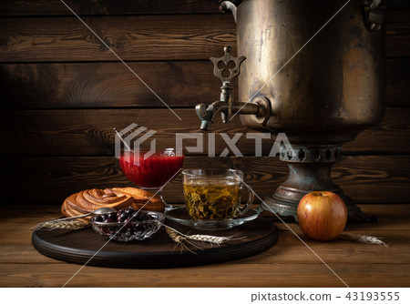 Breakfast. Tea from a samovar with a cheesecake, jam and berries 43193555