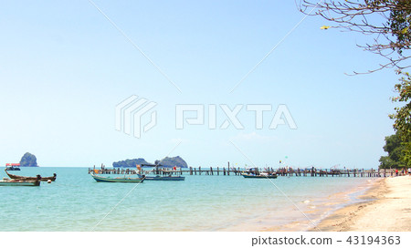 PULAU LANGKAWI, MALAYSIA - APR 7th 2015: Famous black sand beach with ships 43194363