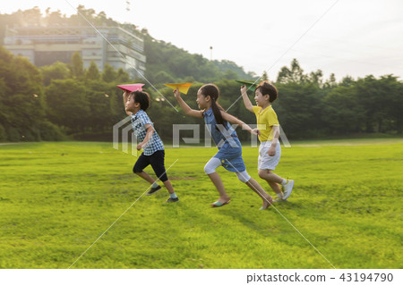 Children, child, child, three people, jumping, running, paper plane, blowing, outdoor play, airplane play, play, jump Children, child, child, three people, jumping, running, paper plane, blowing, outdoor play, airplane play, play, jump 43194790