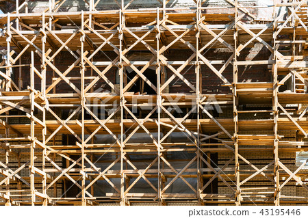 wooden scaffolds on multi-storey building 43195446