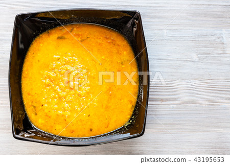 yellow Dal Tadka from lentils with curry on table yellow Dal Tadka from lentils with curry on table 43195653
