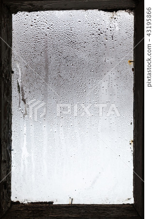 water drops from melting snow on misted window water drops from melting snow on misted window 43195866