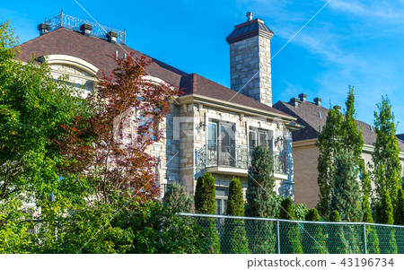 Luxury house in Montreal, Canada against blue sky Luxury house in Montreal, Canada against blue sky 43196734