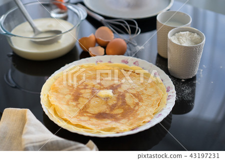 Ingredients for pancake on a black glossy background. Pancake day. 43197231