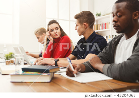 Business meeting. Young team in modern office Business meeting. Young team in modern office 43204365