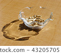 Herbal medicine capsule in a glass bowl 43205705