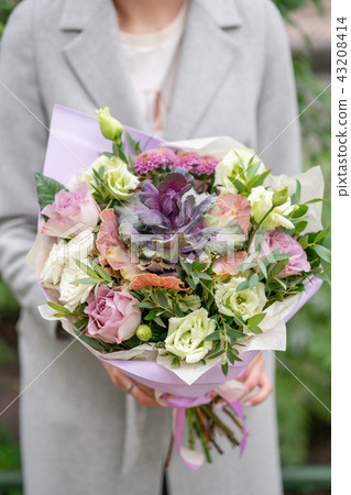 Beautiful spring bouquet. Arrangement with mix flowers. The concept of a flower shop, a small family 43208414