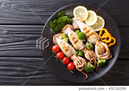 grilled calamari with tentacles with tomatoes grilled calamari with tentacles with tomatoes 43210209