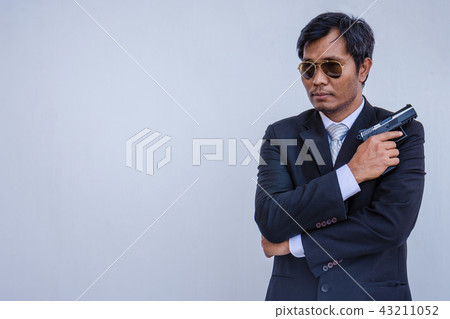 Man holding a gun Man holding a gun 43211052