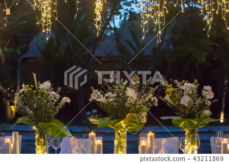 Wedding Banquet or dinner decorated with garlands 43211869