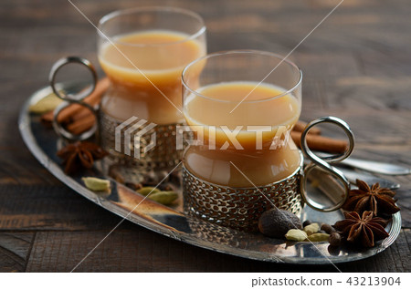 Indian masala chai tea. Spiced tea with milk. Indian masala chai tea. Spiced tea with milk. 43213904