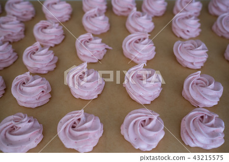 Making French meringue cookies marshmallows on parchment paper Making French meringue cookies marshmallows on parchment paper 43215575