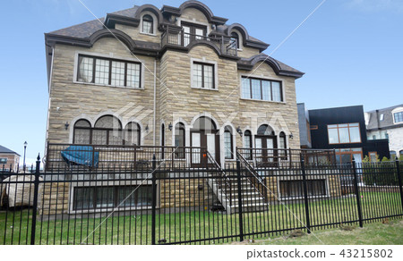 Luxury house in Montreal, Canada against blue sky Luxury house in Montreal, Canada against blue sky 43215802
