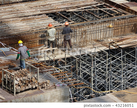Installing reinforcement bar at the site.  43216051