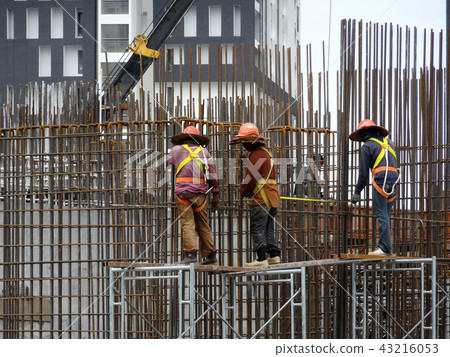 Installing reinforcement bar at the site.  43216053