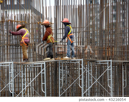 Installing reinforcement bar at the site.  43216054