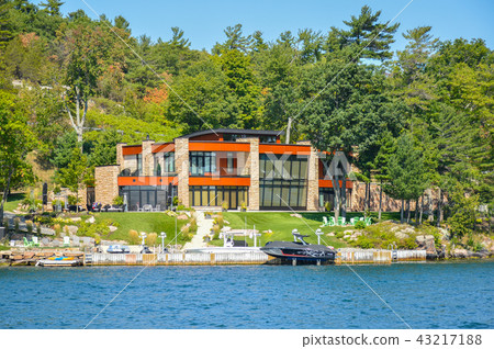 One Island with the white house with a white boat  43217188