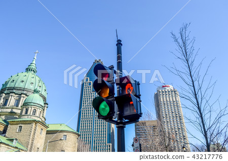 The green traffic light on the sidewalk in Montrea 43217776
