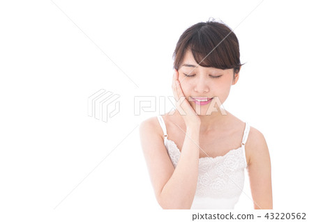 A young woman doing skin care A young woman doing skin care 43220562