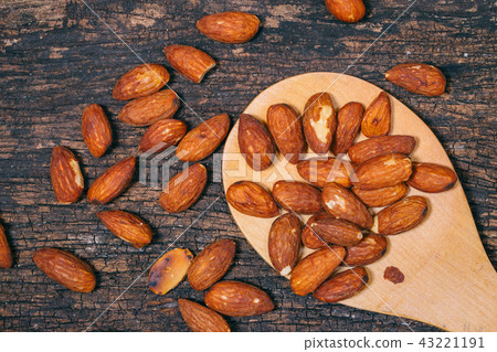 roasted almond nut decoration on wooden table roasted almond nut decoration on wooden table 43221191