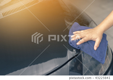 human hand showing cleaning car 43223841