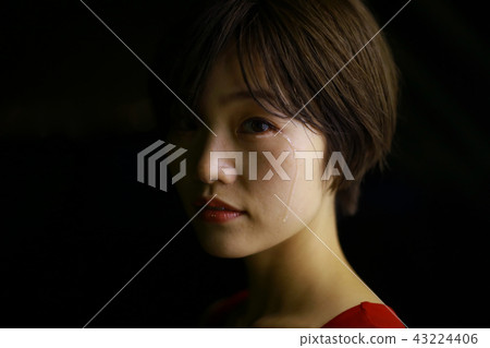 A woman who sheds tears 43224406