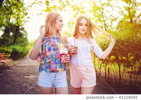 Trendy teen women with drinks 43228095