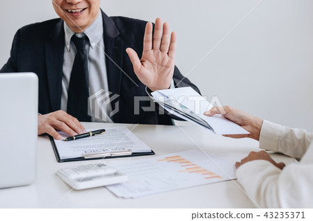 Bribery and corruption concept, senior businessman manager refus 43235371