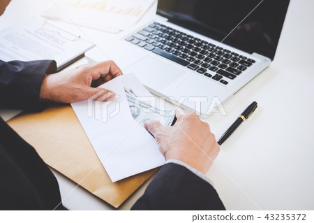 Money in human hands form of dollar bills, Businessman is counti 43235372