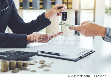 Salesman send key to customer after good deal agreement and rece 43235442