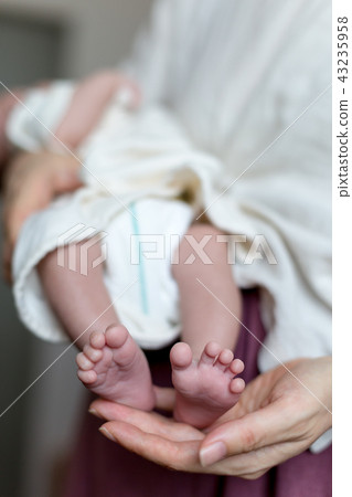 Embracing baby 43235958