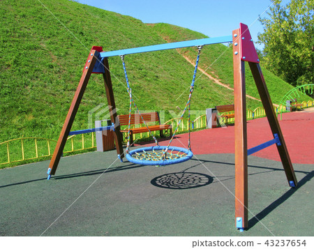 Hanging swings at childrens playground Hanging swings at childrens playground 43237654