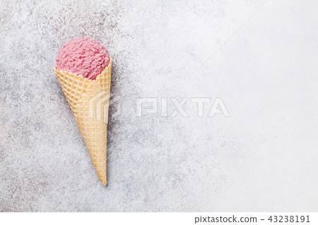 Ice cream cone with berry scoop Ice cream cone with berry scoop 43238191