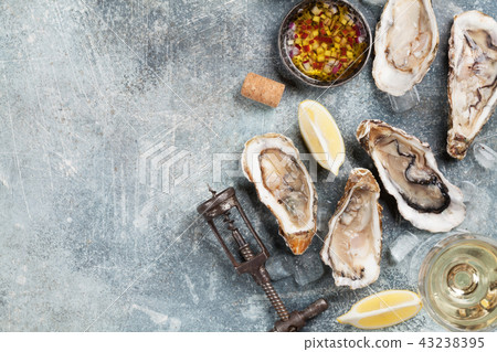 Fresh oysters and white wine Fresh oysters and white wine 43238395