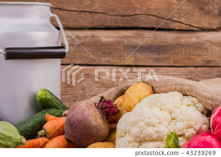 Gather of raw vegetarian food and milk can. 43239269