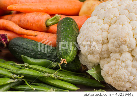 Cauliflower, cucumber, peas and carrots. Cauliflower, cucumber, peas and carrots. 43239442