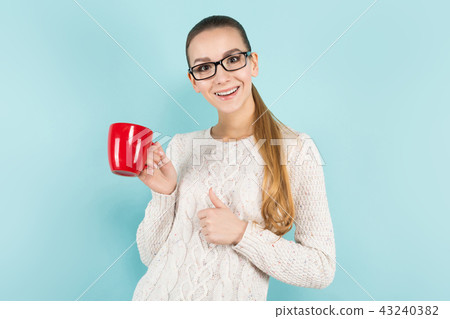 Attractive woman with ponytail and cup 43240382