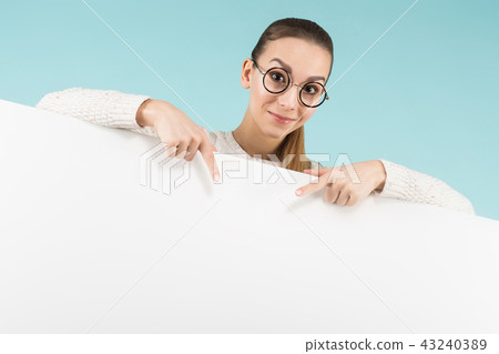 Attractive young woman with blank banner Attractive young woman with blank banner 43240389