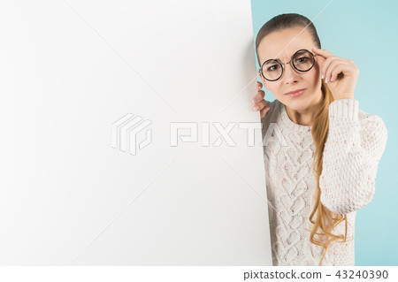 Attractive young woman with blank banner Attractive young woman with blank banner 43240390