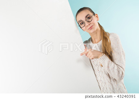 Attractive young woman with blank banner Attractive young woman with blank banner 43240391