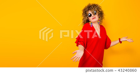 Attractive woman with short curly hair 43240860