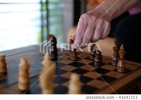 hand playing chess game. business plan & analysis for success. risk & strategy concept 43241151