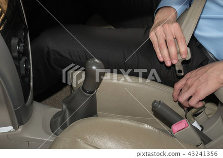 man fasten seat belt in car before driving. automobile safety protection concept 43241356